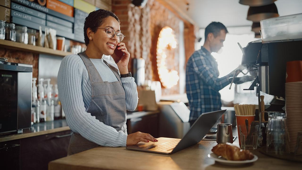 A small-business owner working from a laptop